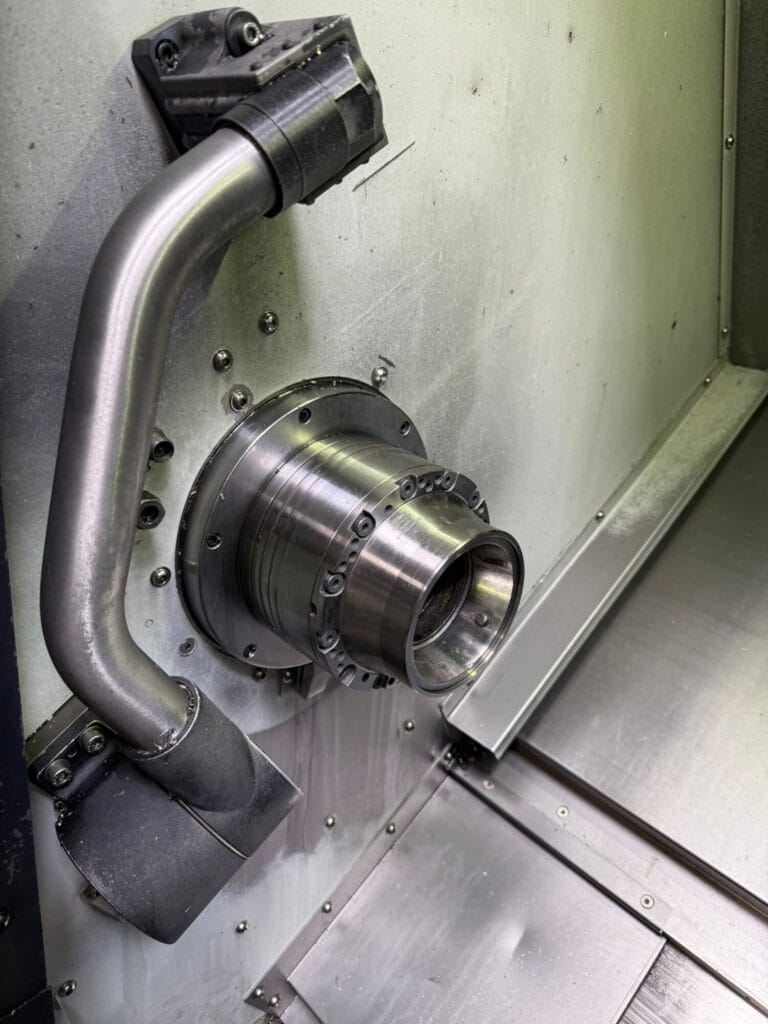 Close-up of CNC spindle chuck on Doosan lathe