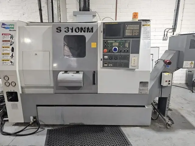 CNC lathe machine in an industrial manufacturing workshop