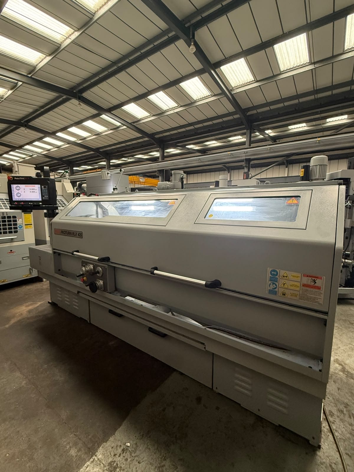 Industrial CNC lathe in a manufacturing workshop